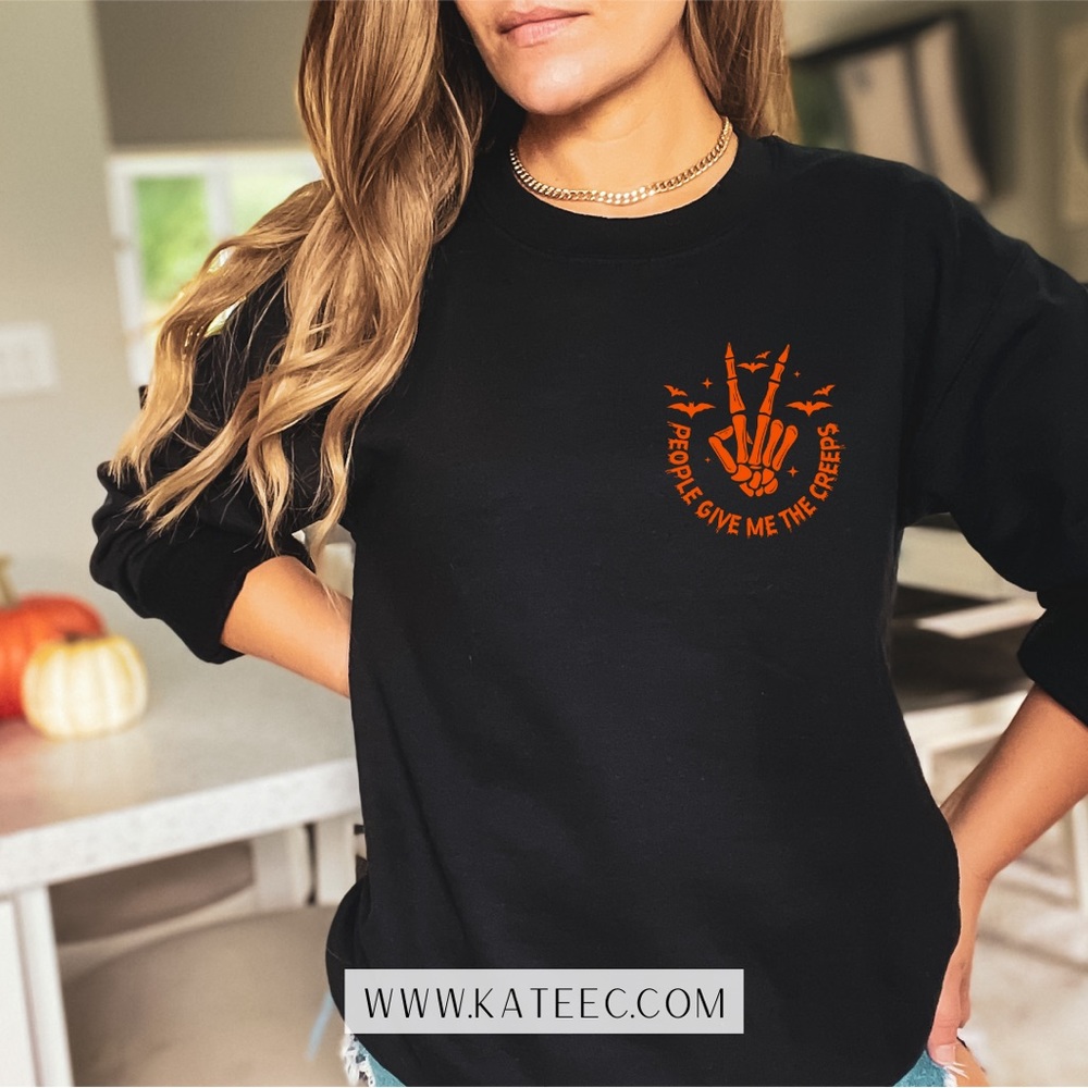 Trendy Graphic Design on the softest crew neck sweater in your closet!!